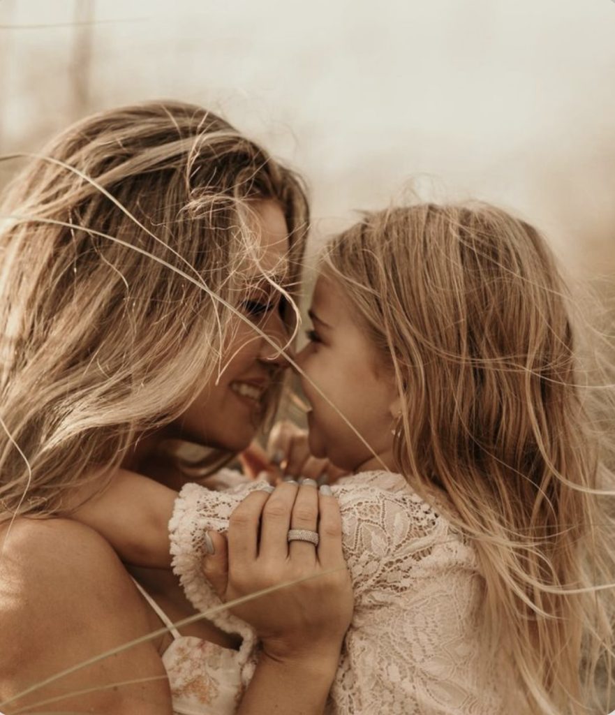 Mother and daughter hugging