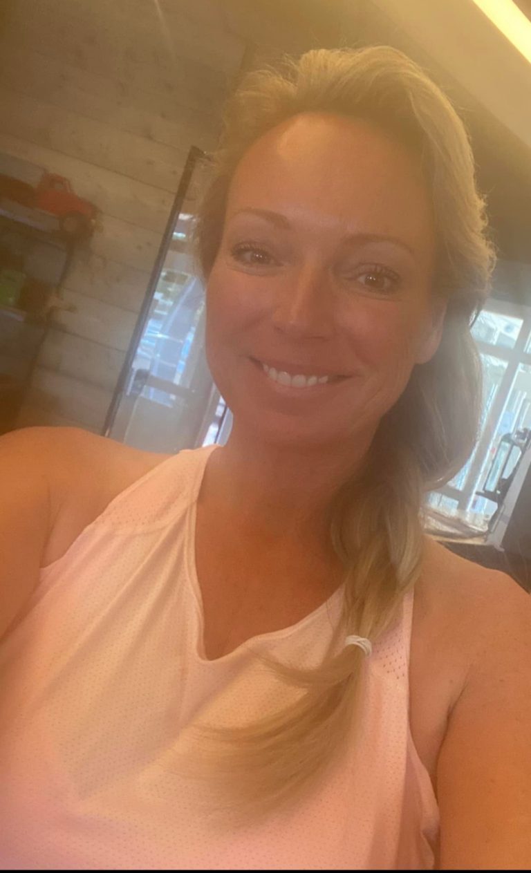 Active woman in bold fitness clothing, embodying empowerment and motivation. Nicole