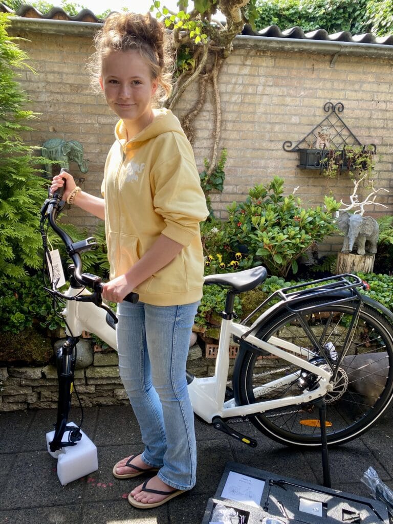 Girl placing her new bike From Fiido together