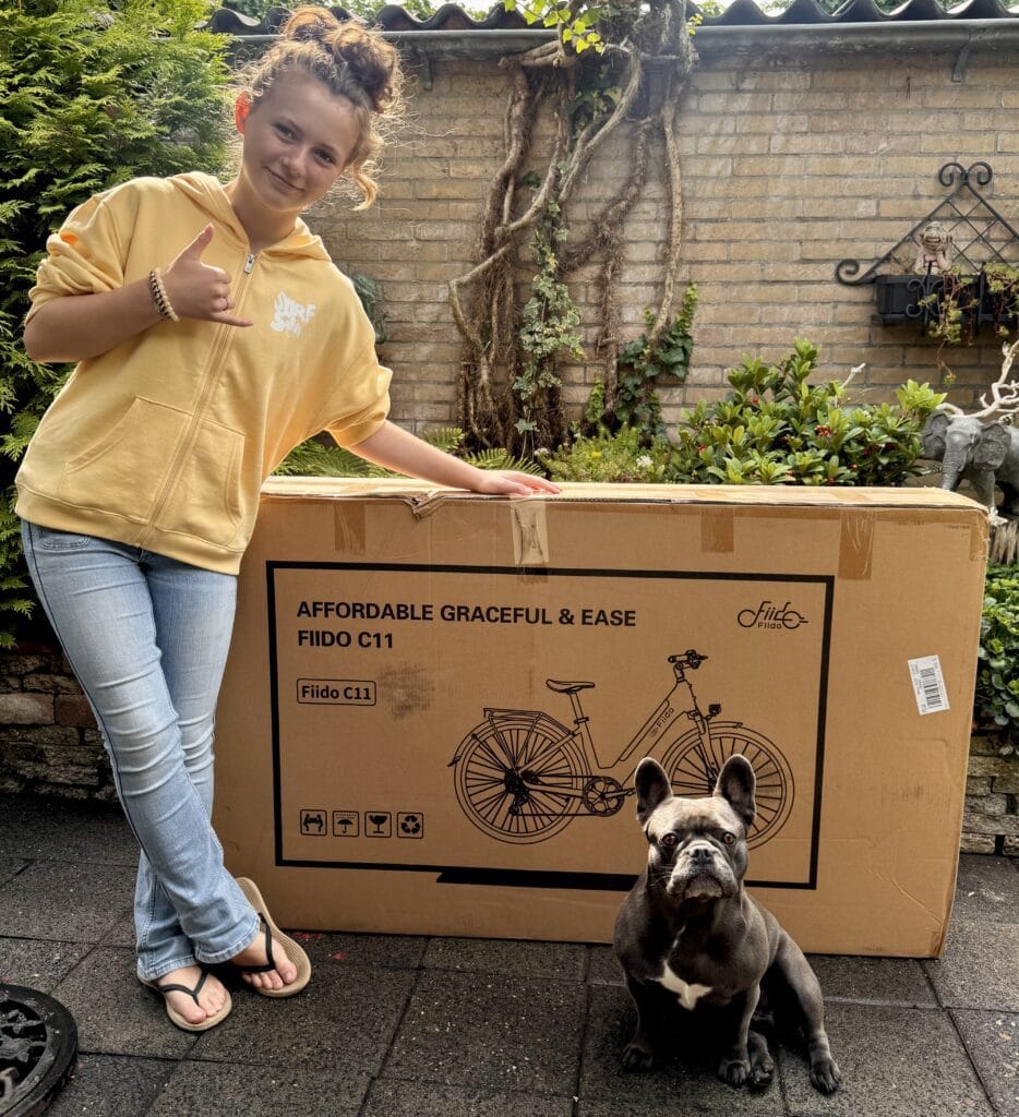 Girl Girl unwrapping her package from Fiido