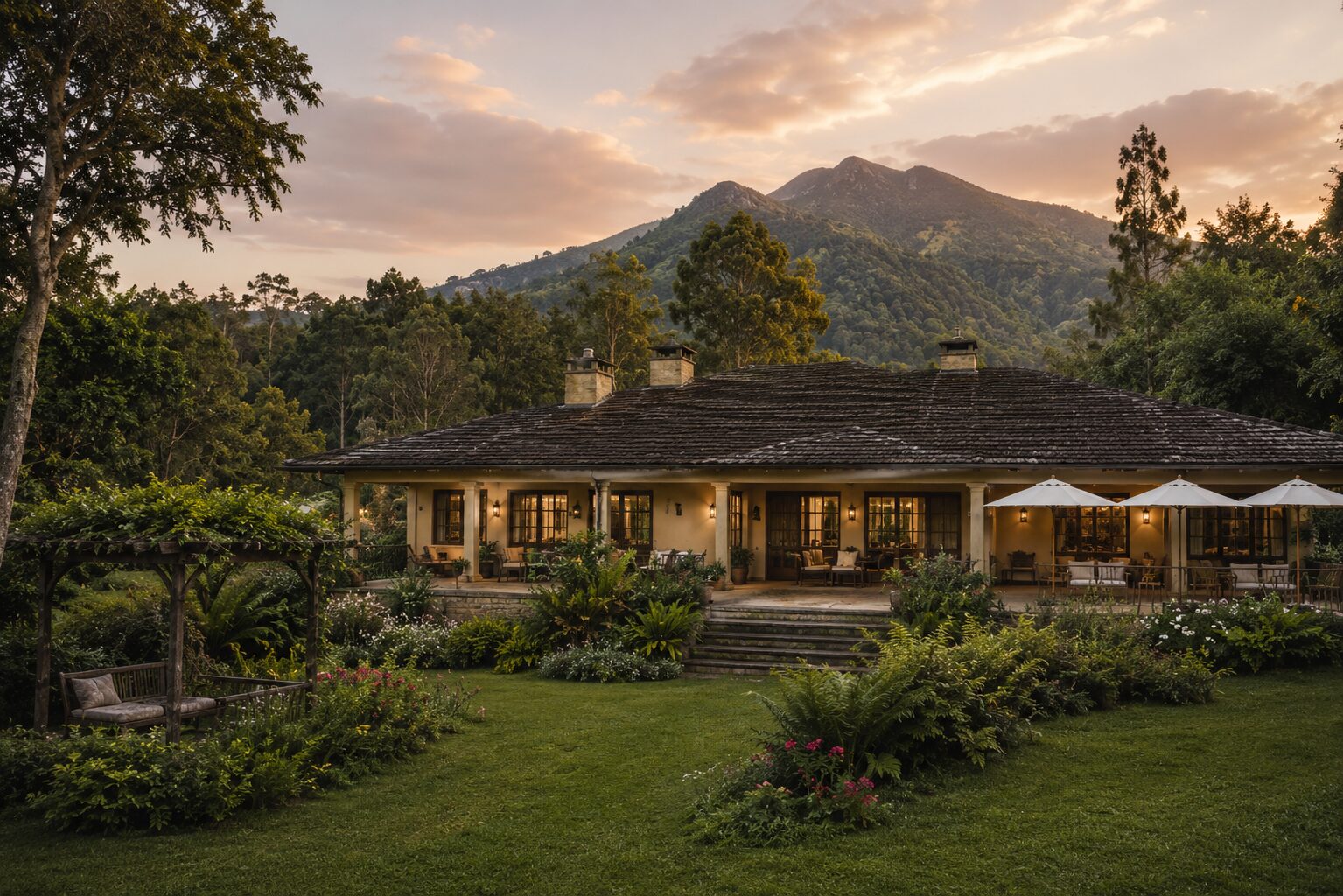 Luxury lodge exterior surrounded by gardens and mountain scenery near Volcanoes National Park in Rwanda